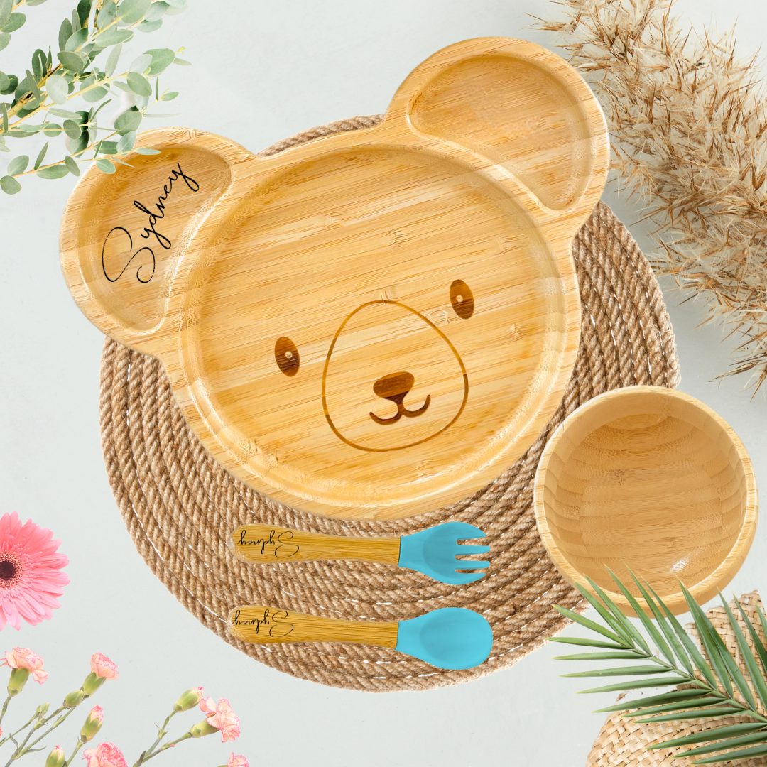 Bamboo baby plate beside a plastic plate, comparing eco-friendly and plastic dinnerware