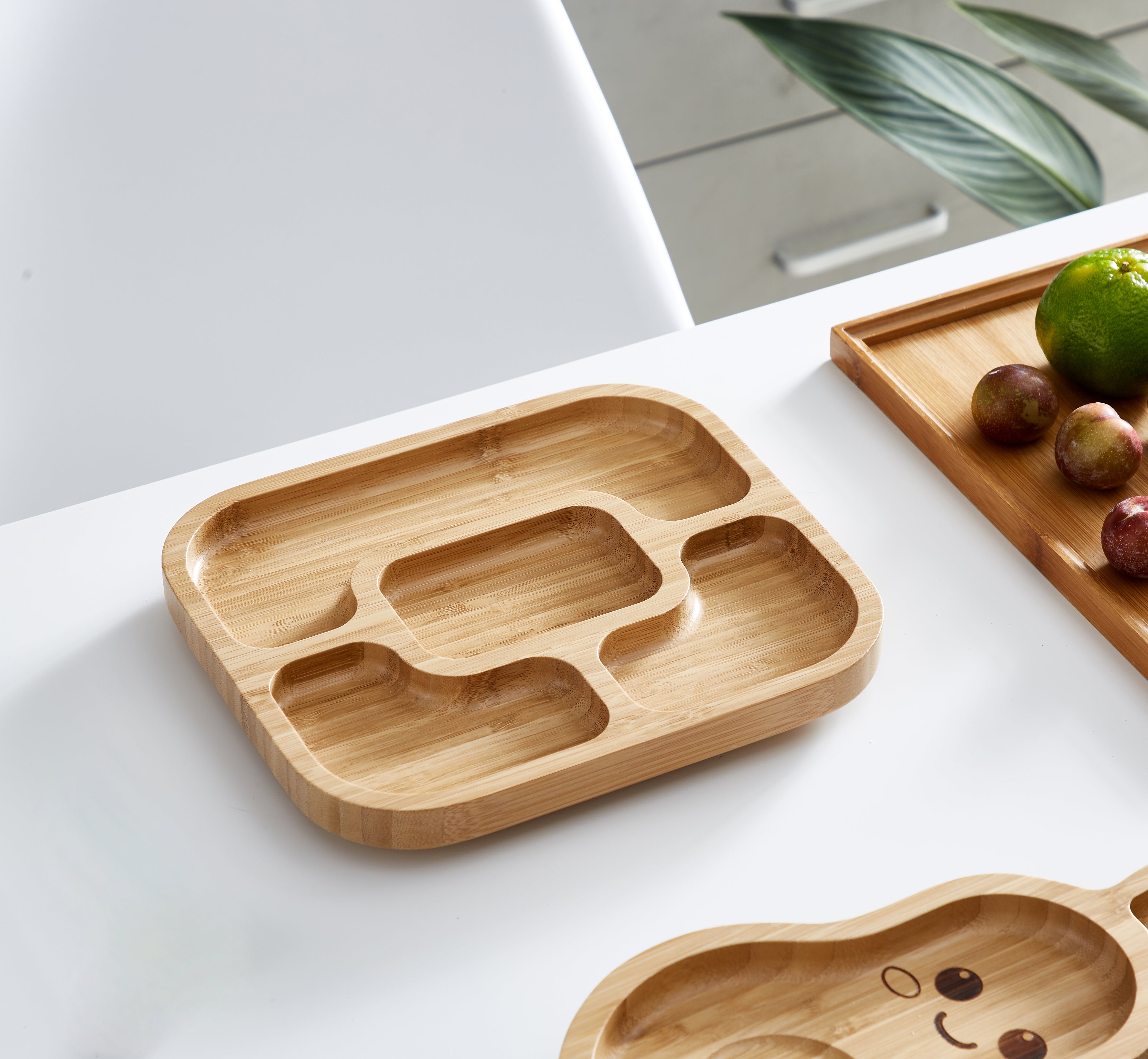 A baby bamboo plate with a suction base, designed for mess-free mealtime