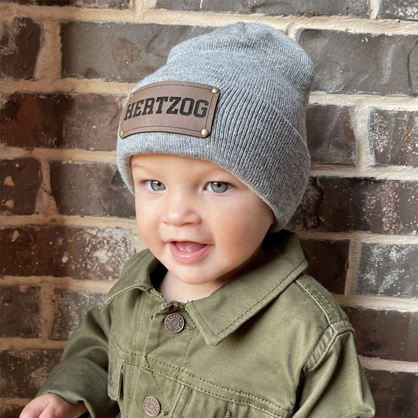 Personalized baby beanie with custom vegan leather name patch for ages 2 months to 2 years – unisex winter hat